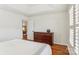 Bright bedroom featuring wood floors and a tray ceiling at 4509 Kaylied Dr, Fort Mill, SC 29707