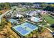 Aerial view of the community clubhouse, tennis courts, and outdoor pool at 473 Bowline Dr, Denver, NC 28037