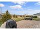 Private backyard featuring a brick patio, seating area, and a picturesque neighborhood view at 473 Bowline Dr, Denver, NC 28037