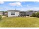 A spacious backyard with a paver patio, screened in porch and grill at 473 Bowline Dr, Denver, NC 28037
