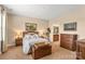 Comfortable bedroom featuring neutral walls, soft carpet, and warm, inviting lamps at 473 Bowline Dr, Denver, NC 28037