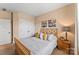Cozy bedroom with wood-frame bed, side tables, decor, and double door closets at 473 Bowline Dr, Denver, NC 28037
