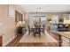Bright dining area with wood flooring, large windows, and access to the patio and living space at 473 Bowline Dr, Denver, NC 28037