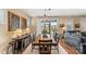 Traditional dining room showcasing wooden table set, artwork and sliding glass door at 473 Bowline Dr, Denver, NC 28037