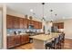 Well-equipped kitchen with stainless steel appliances, granite countertops, and a breakfast bar at 473 Bowline Dr, Denver, NC 28037