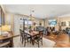 Spacious living area with a dining area, living room with fireplace, and sliding door to the patio at 473 Bowline Dr, Denver, NC 28037