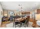 Open concept living space featuring dining area, living room with fireplace, and kitchen at 473 Bowline Dr, Denver, NC 28037