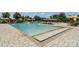 Inviting community outdoor pool area featuring lounge chairs, umbrellas, and a wading area at 473 Bowline Dr, Denver, NC 28037