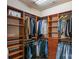 Spacious walk-in closet with custom shelving and hanging rods for optimal organization at 473 Bowline Dr, Denver, NC 28037