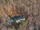 Aerial view of a home nestled among dense trees at 4775 Lands End Trl, Alexis, NC 28006