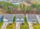 A high angle view shows several homes and community pool surrounded by green trees and lawns at 4849 Tacoma Dr, Fort Mill, SC 29707