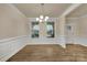 This dining room features hardwood floors, large windows, and crown molding at 4849 Tacoma Dr, Fort Mill, SC 29707