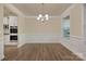 The dining room has hardwood floors, large windows, with a view into the kitchen area at 4849 Tacoma Dr, Fort Mill, SC 29707