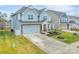 Charming two-story home featuring a stone-accented facade, attached two-car garage and a well-manicured lawn at 4849 Tacoma Dr, Fort Mill, SC 29707