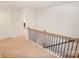 Open hallway with neutral carpet and modern railing and carpeted stairs at 4849 Tacoma Dr, Fort Mill, SC 29707