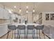 Kitchen island featuring bar stool seating, white countertops, and stainless steel appliances at 4849 Tacoma Dr, Fort Mill, SC 29707