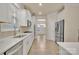 Modern kitchen with stainless steel appliances, white cabinets, and sleek countertops at 4849 Tacoma Dr, Fort Mill, SC 29707