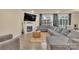 Inviting living room features a cozy fireplace, large sectional sofa, and lots of natural light at 4849 Tacoma Dr, Fort Mill, SC 29707