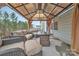 Backyard patio features an outdoor living space with plush seating and a fire pit at 4849 Tacoma Dr, Fort Mill, SC 29707