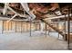 Unfinished basement with exposed utilities and wooden stairs at 49 8Th Se St, Hickory, NC 28602