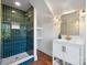 Stylish bathroom with a walk-in shower and green tile at 49 8Th Se St, Hickory, NC 28602