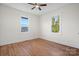 Bright bedroom with hardwood floors and two windows at 49 8Th Se St, Hickory, NC 28602