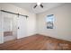 Bedroom with hardwood floors and barn door at 49 8Th Se St, Hickory, NC 28602