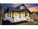 Charming renovated bungalow with a white brick facade and a welcoming front porch at 49 8Th Se St, Hickory, NC 28602