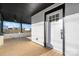 Inviting front porch with wood decking, white brick columns, and ceiling fan at 49 8Th Se St, Hickory, NC 28602