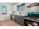 Kitchen features gray cabinets, white countertops, and stainless steel appliances at 49 8Th Se St, Hickory, NC 28602