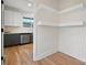 Modern kitchen boasts dark cabinetry, stainless steel appliances, and white countertops at 49 8Th Se St, Hickory, NC 28602