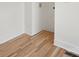 Small laundry room with hardwood floors and white walls at 49 8Th Se St, Hickory, NC 28602