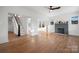 Bright living room featuring hardwood floors, a cozy fireplace, and plenty of natural light at 49 8Th Se St, Hickory, NC 28602