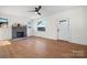 Sunlit living room with a decorative fireplace, hardwood floors, and a welcoming atmosphere at 49 8Th Se St, Hickory, NC 28602