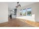 Bright and airy living space with hardwood floors and large windows, open to the modern kitchen at 49 8Th Se St, Hickory, NC 28602