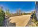 Large backyard featuring a spacious lawn and landscaped garden beds, providing privacy and tranquility at 520 Crawfish Dr, Fort Mill, SC 29708