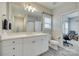 Bathroom with lots of natural light, features a shower and vanity at 520 Crawfish Dr, Fort Mill, SC 29708