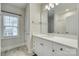 Bright bathroom features a white vanity with quartz countertop and a large mirror at 520 Crawfish Dr, Fort Mill, SC 29708