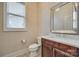 Powder room with stylish vanity, modern mirror, and neutral color scheme at 520 Crawfish Dr, Fort Mill, SC 29708
