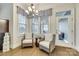 Cozy breakfast nook featuring wicker chairs, pendant lighting, and view to an outdoor living area at 520 Crawfish Dr, Fort Mill, SC 29708