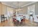 Elegant dining room featuring modern lighting, hardwood floors, and access to the living spaces at 520 Crawfish Dr, Fort Mill, SC 29708