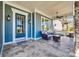 Cozy front porch with comfortable seating, a ceiling fan, and elegant tile flooring at 520 Crawfish Dr, Fort Mill, SC 29708