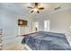 Comfortable bedroom featuring a large bed, a ceiling fan, and an adjoining bathroom at 520 Crawfish Dr, Fort Mill, SC 29708