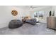 Cozy bedroom with a window, gray carpet, a full-size bed, neutral walls, and a dresser at 7019 Lenton Rd, Charlotte, NC 28215