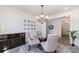 Bright dining room with seating for four and classic architectural details at 7019 Lenton Rd, Charlotte, NC 28215