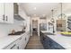 Updated kitchen with white cabinets, stainless steel appliances, and black hardware at 7019 Lenton Rd, Charlotte, NC 28215