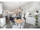 Bright eat-in kitchen features a large island, stainless steel appliances, and modern lighting at 7019 Lenton Rd, Charlotte, NC 28215