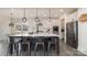 Spacious kitchen island with barstool seating, stainless appliances, and modern pendant lighting at 7019 Lenton Rd, Charlotte, NC 28215
