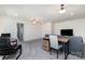 Entertainment room with sofa, work desk and chair, and an adjoining sitting room at 7019 Lenton Rd, Charlotte, NC 28215