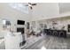 Bright and airy open-concept living space featuring a modern kitchen, comfortable seating area, and large windows at 7019 Lenton Rd, Charlotte, NC 28215